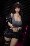 Eve by FunWest Dolls, gray cropped tank and black jacket against a dark backdrop