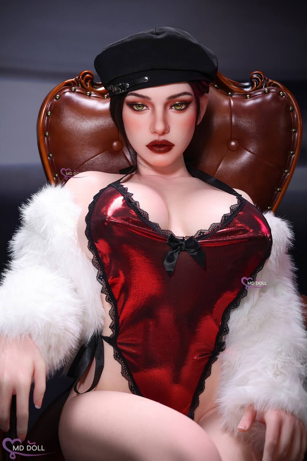 MD Doll Leona seated facing forward in a white wrap