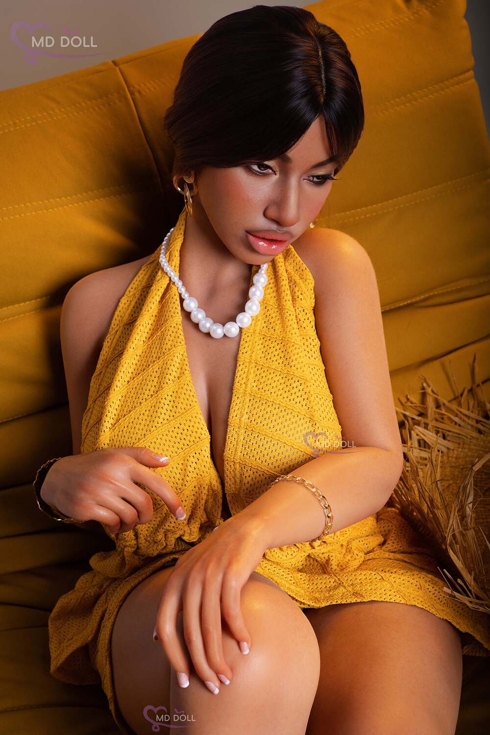 MD Doll Luna seated with one hand resting on her knee