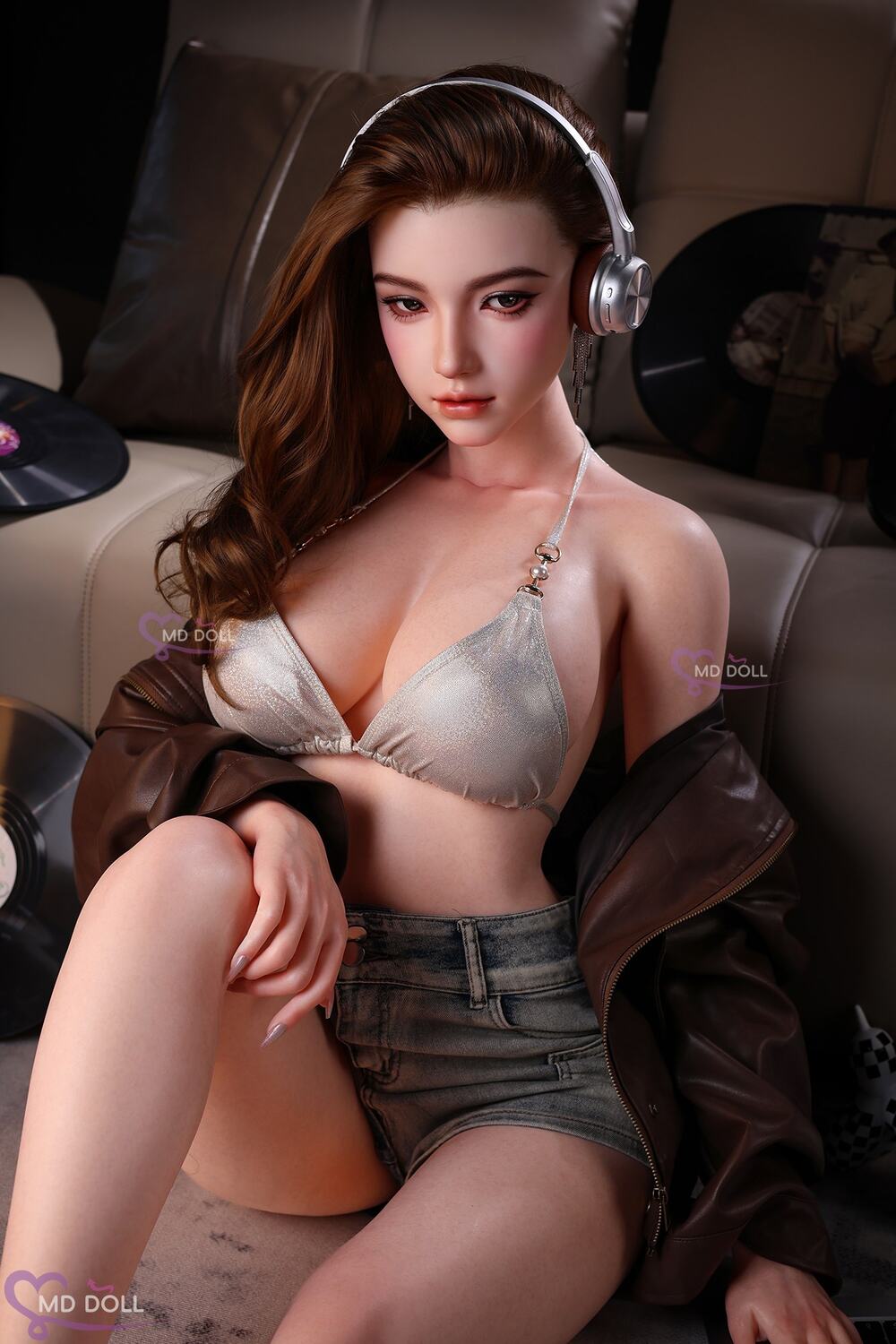MD Doll Heather wearing headphones while seated