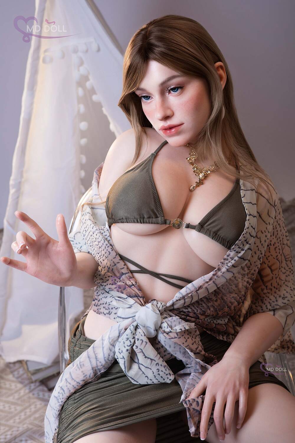 MD Doll Joanna seated with one hand raised