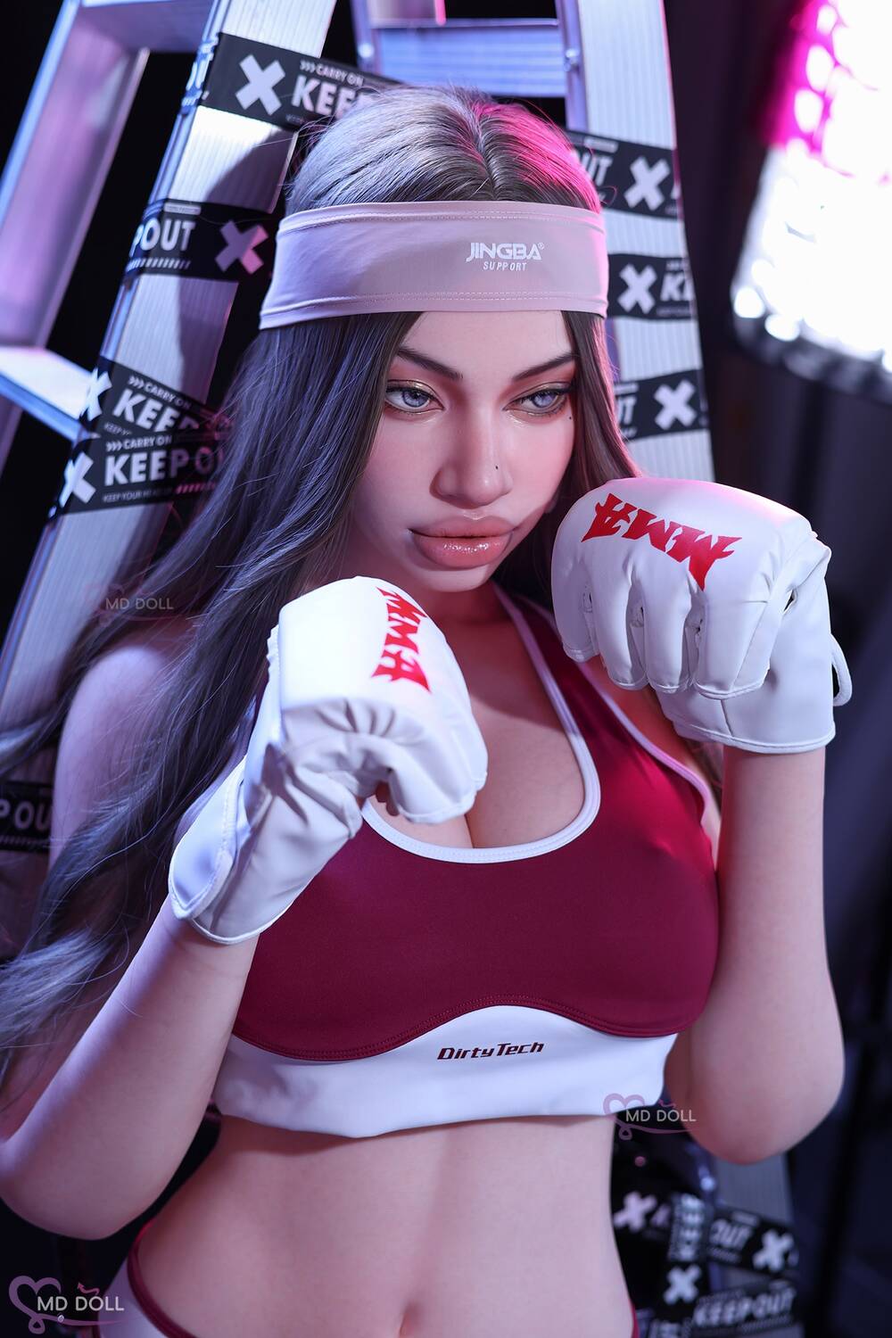 MD Doll Brianna holding both boxing gloves near her face