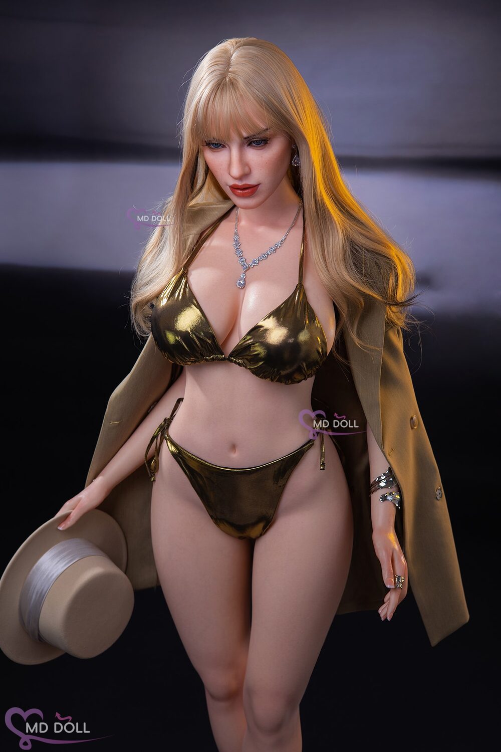 MD Doll Jennifer holding the hat beside her hip